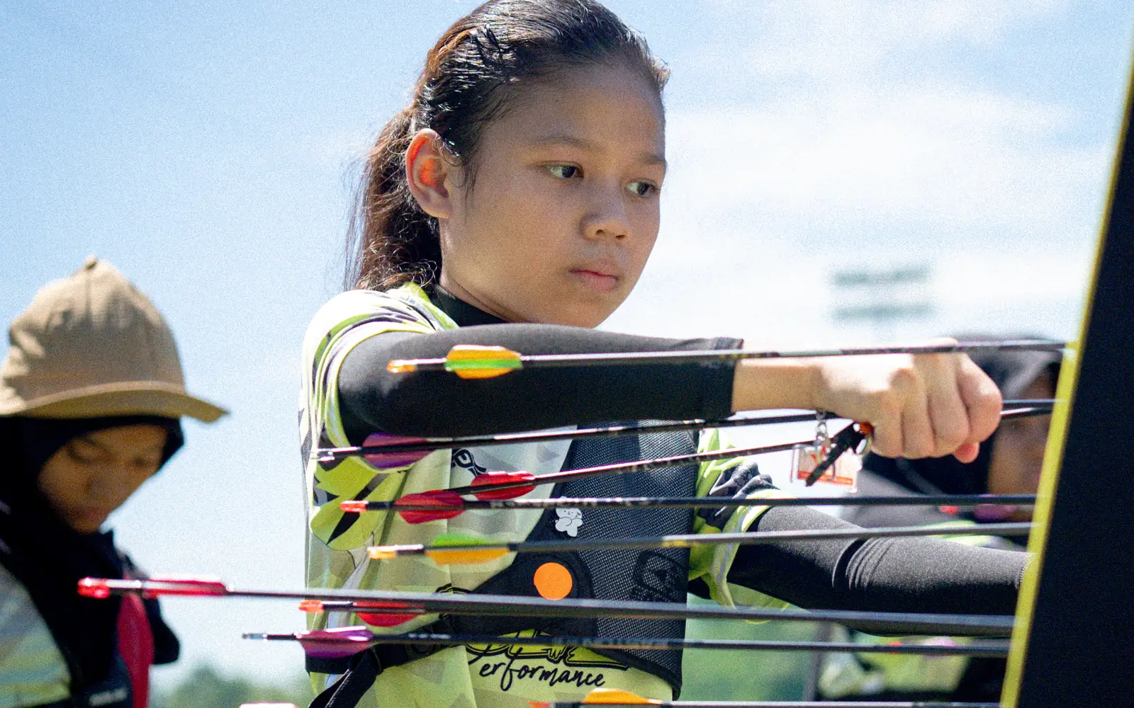 A Boltz archer at the target boss, checking her arrows after an end